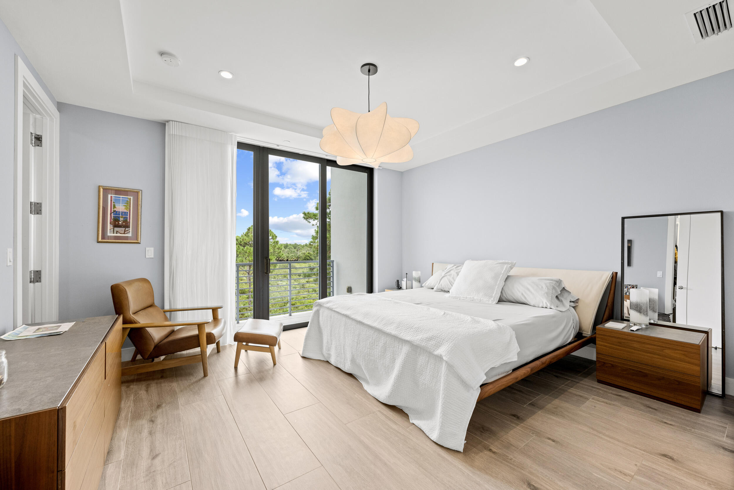 1811 Northwest 42nd Drive Boca Raton, FL 33431 - Photo 30 of 51 a bedroom with a bed and a chandelier