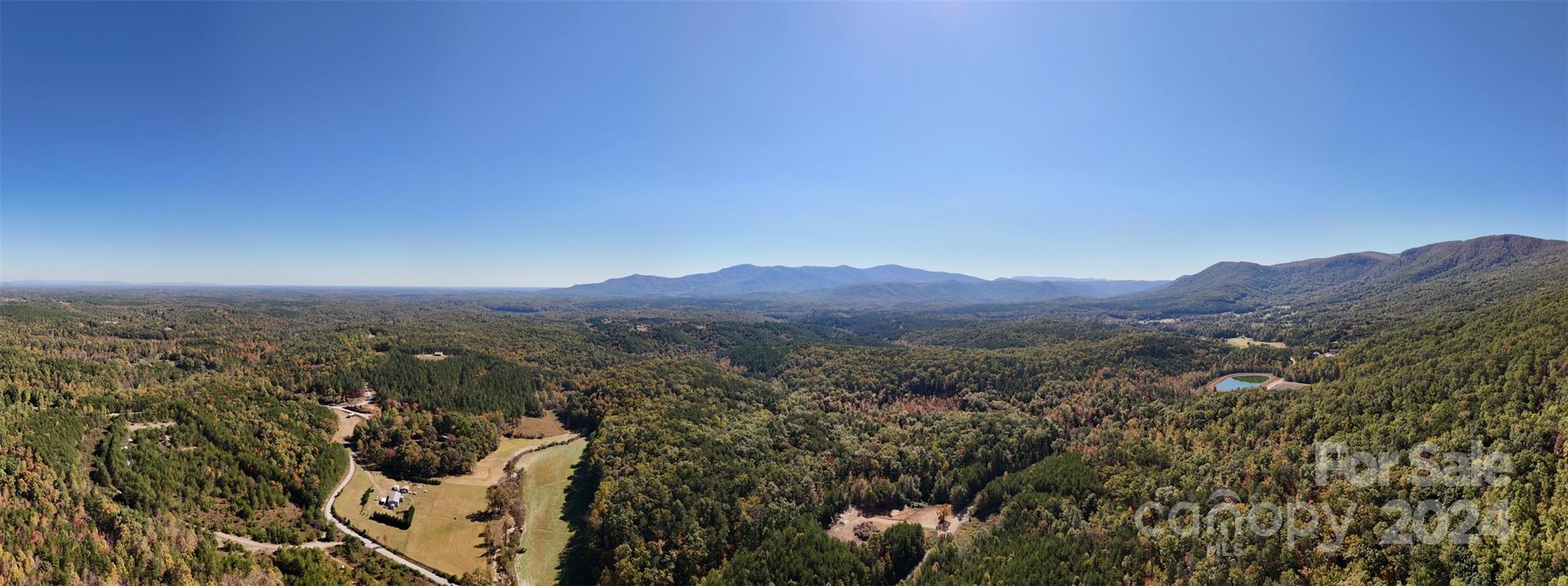 46.6-acres Regan Jackson Road Mill Spring, NC 28756 - Photo 21 of 28 a view of a city with lush green forest