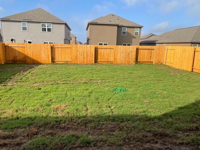 18741 Speculator Lane Elgin, TX 78621 - Photo 27 of 28 Fenced backyard with a residential view