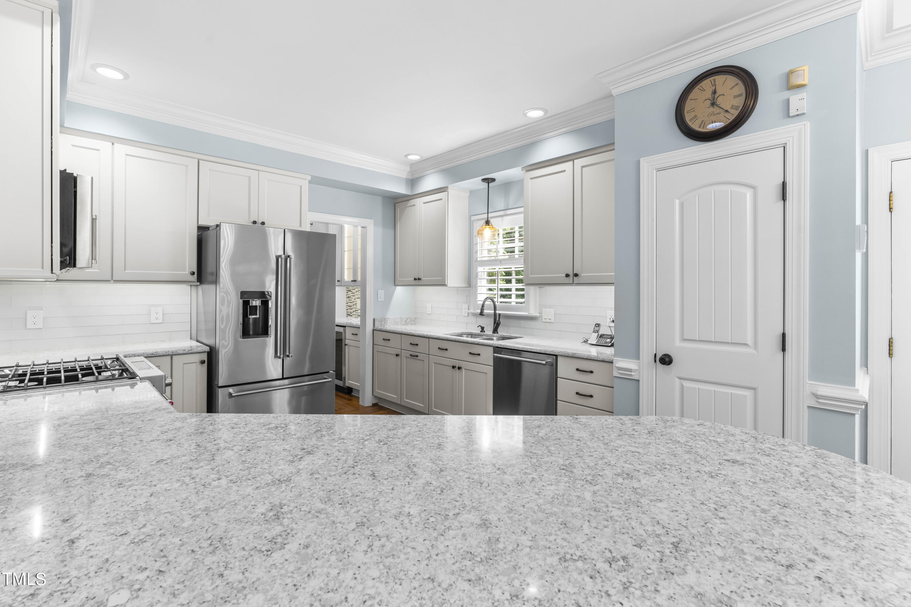 1556 Crenshaw Point Wake Forest, NC 27587 - Photo 12 of 46 a large kitchen with a stove a refrigerator and a sink
