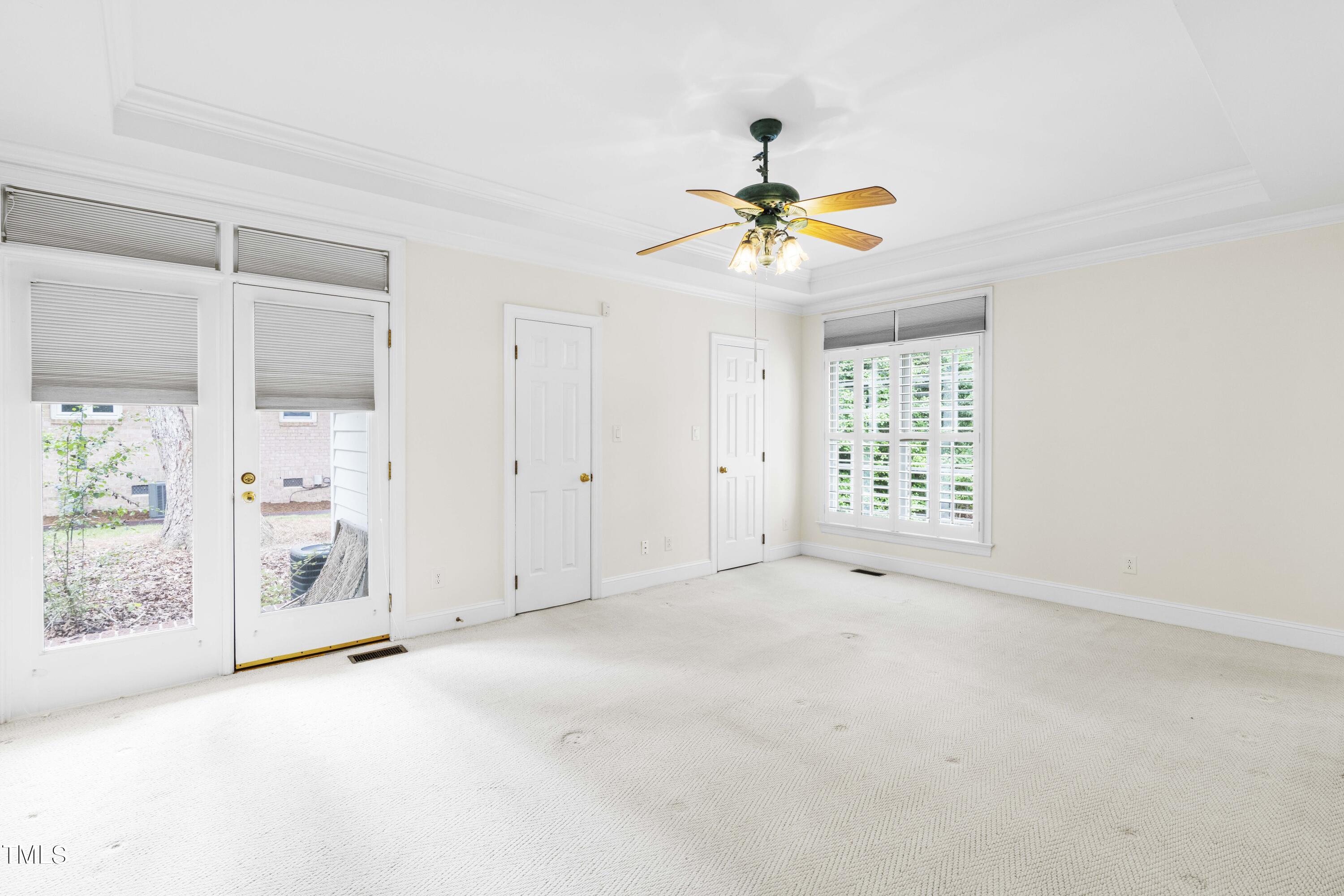 1556 Crenshaw Point Wake Forest, NC 27587 - Photo 21 of 46 an empty room with windows and fan
