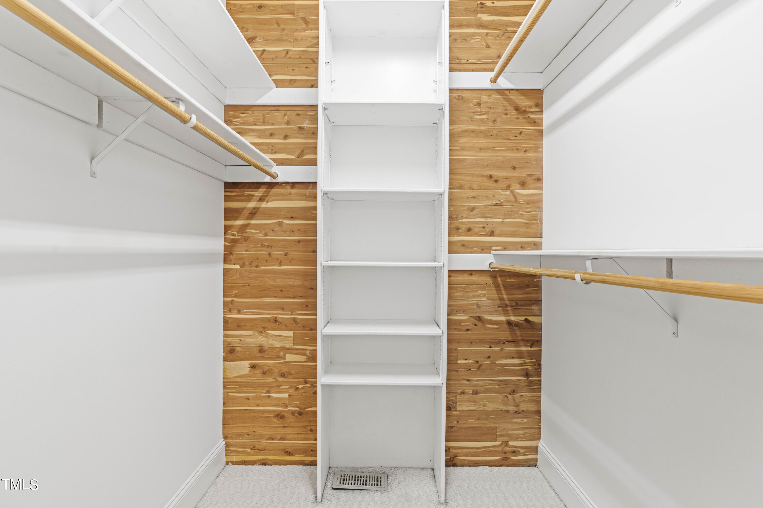 1556 Crenshaw Point Wake Forest, NC 27587 - Photo 23 of 46 a view of walk in closet with empty racks