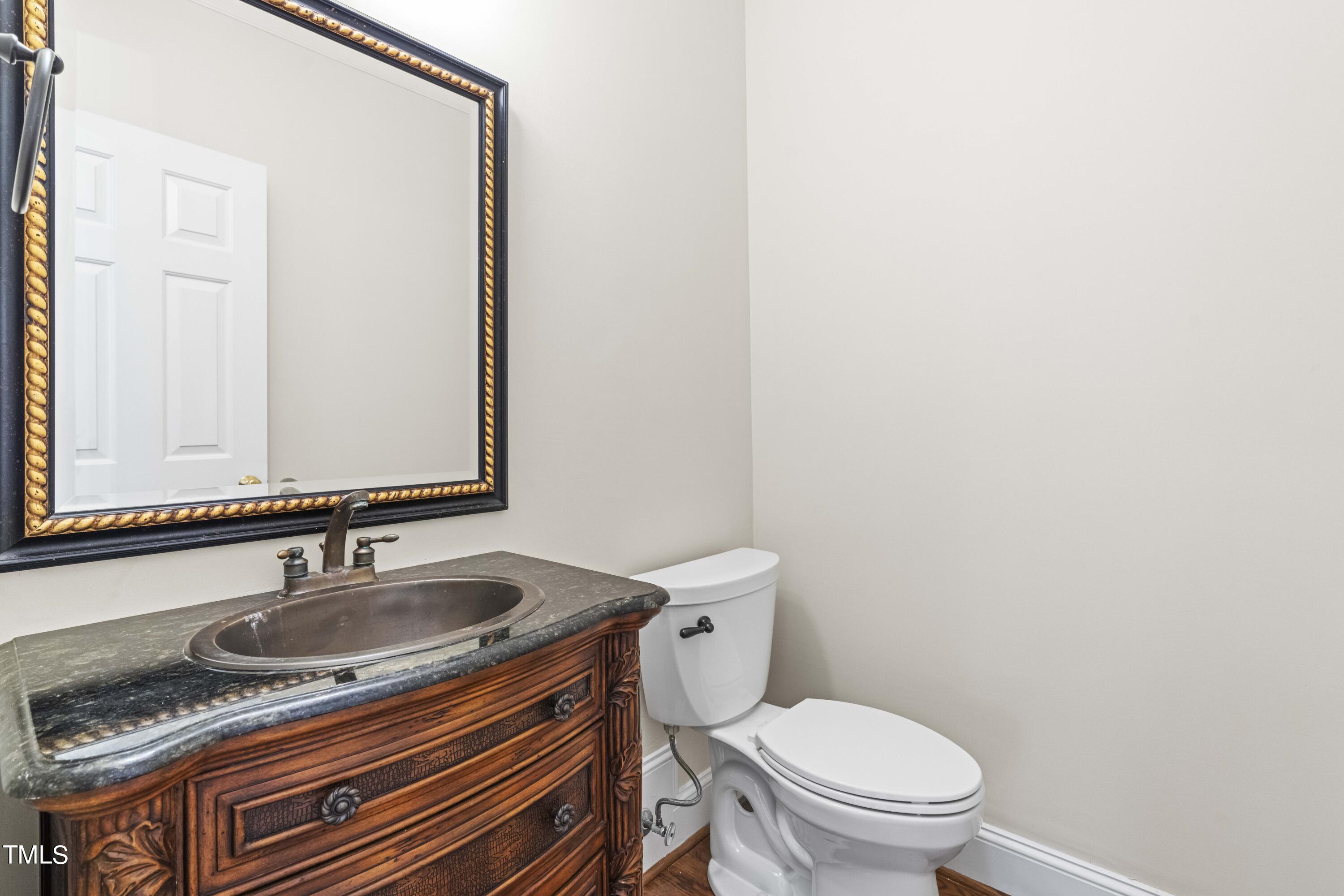 1556 Crenshaw Point Wake Forest, NC 27587 - Photo 27 of 46 a bathroom with a sink and a toilet