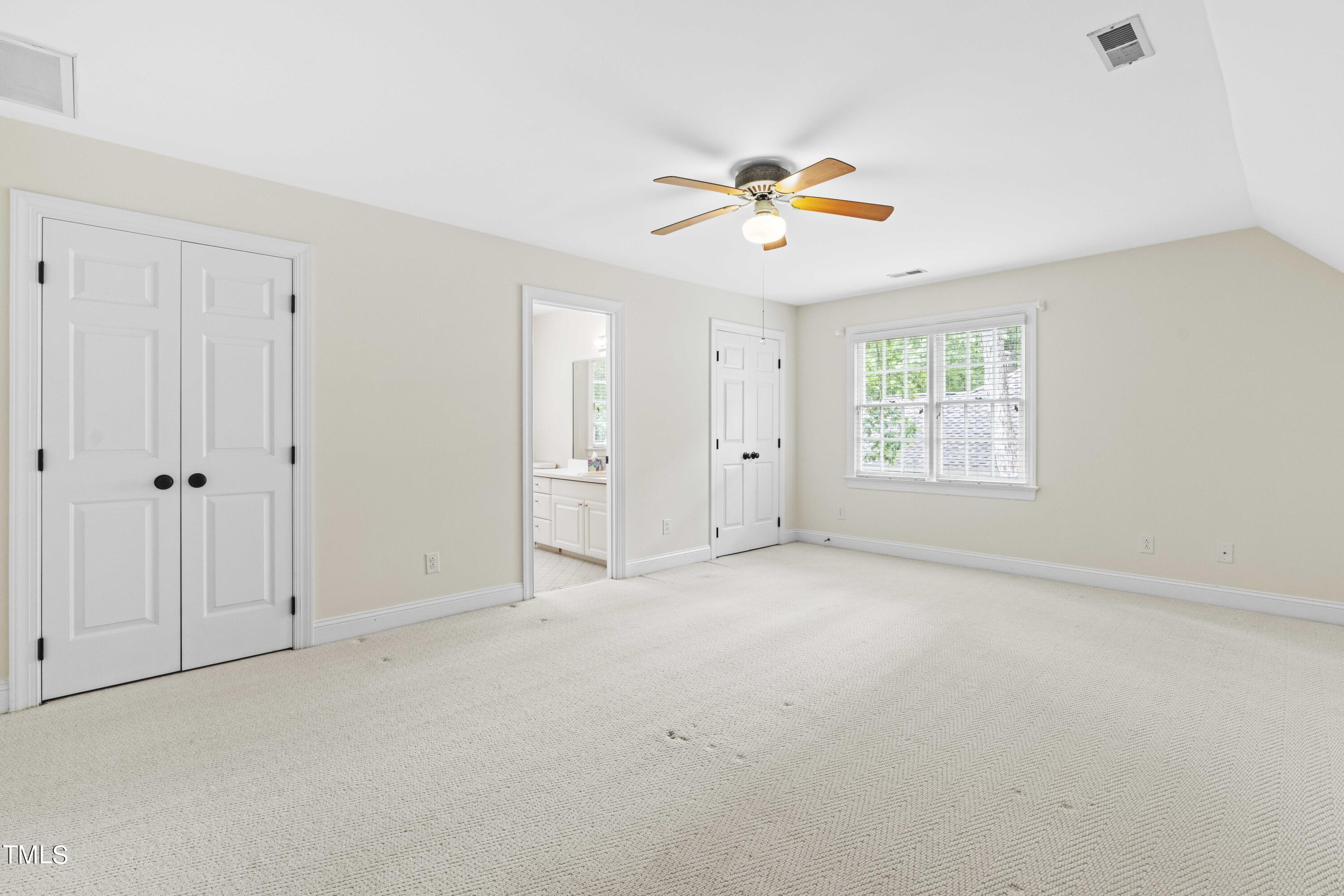 1556 Crenshaw Point Wake Forest, NC 27587 - Photo 30 of 46 an empty room with a window and a ceiling fan