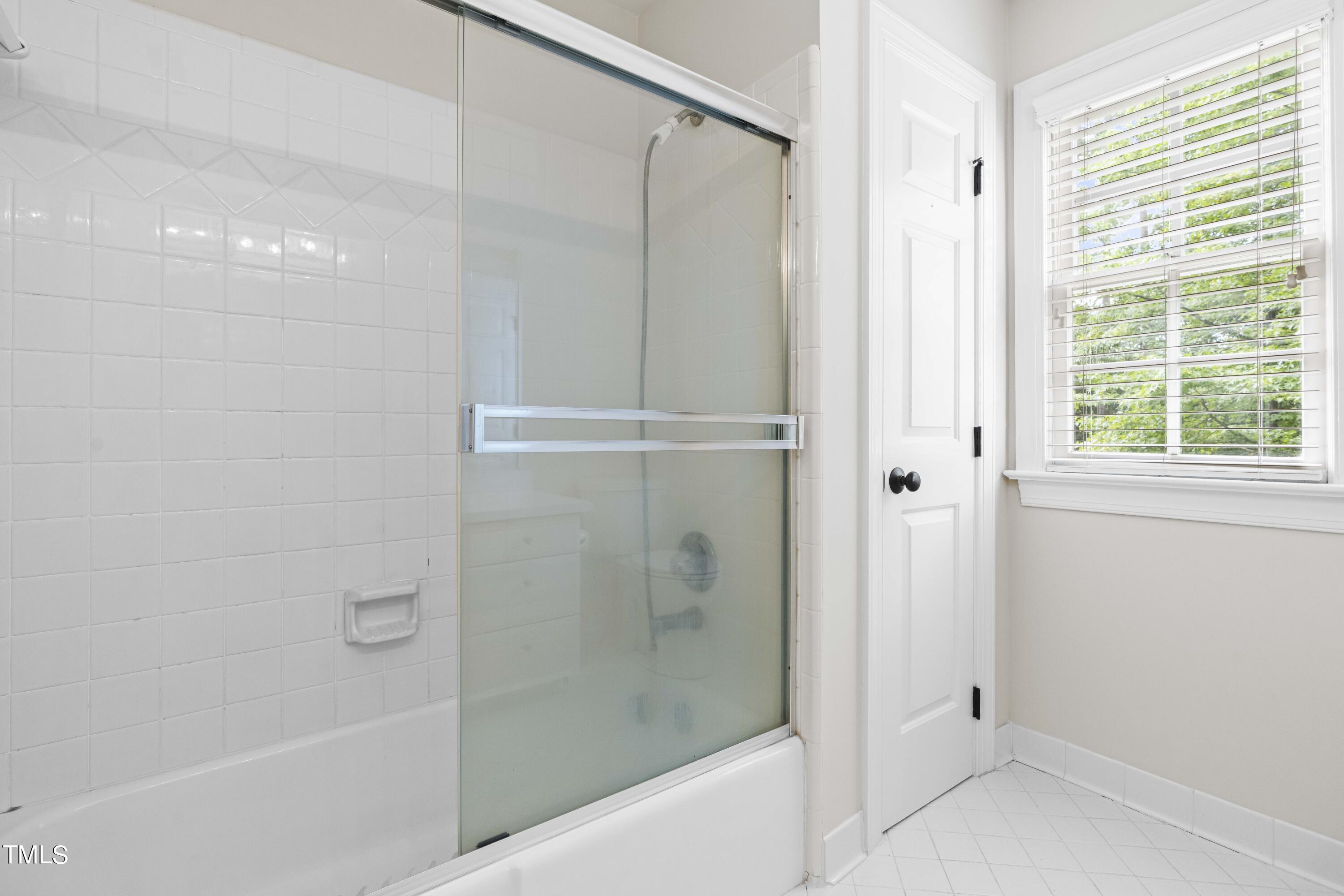 1556 Crenshaw Point Wake Forest, NC 27587 - Photo 32 of 46 a bathroom with a shower