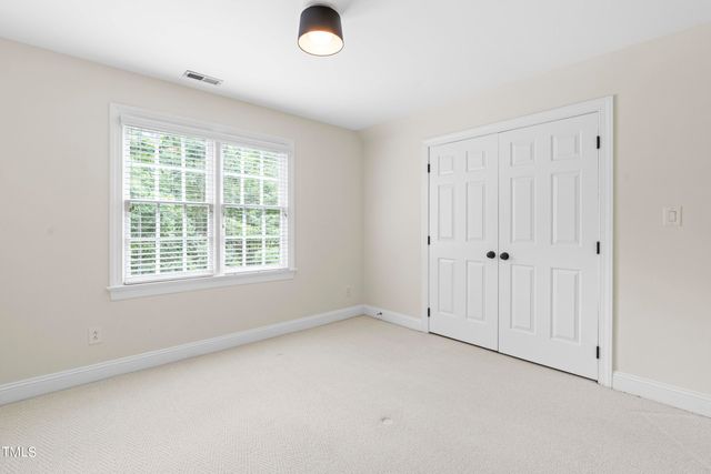 an empty room with a empty space and windows