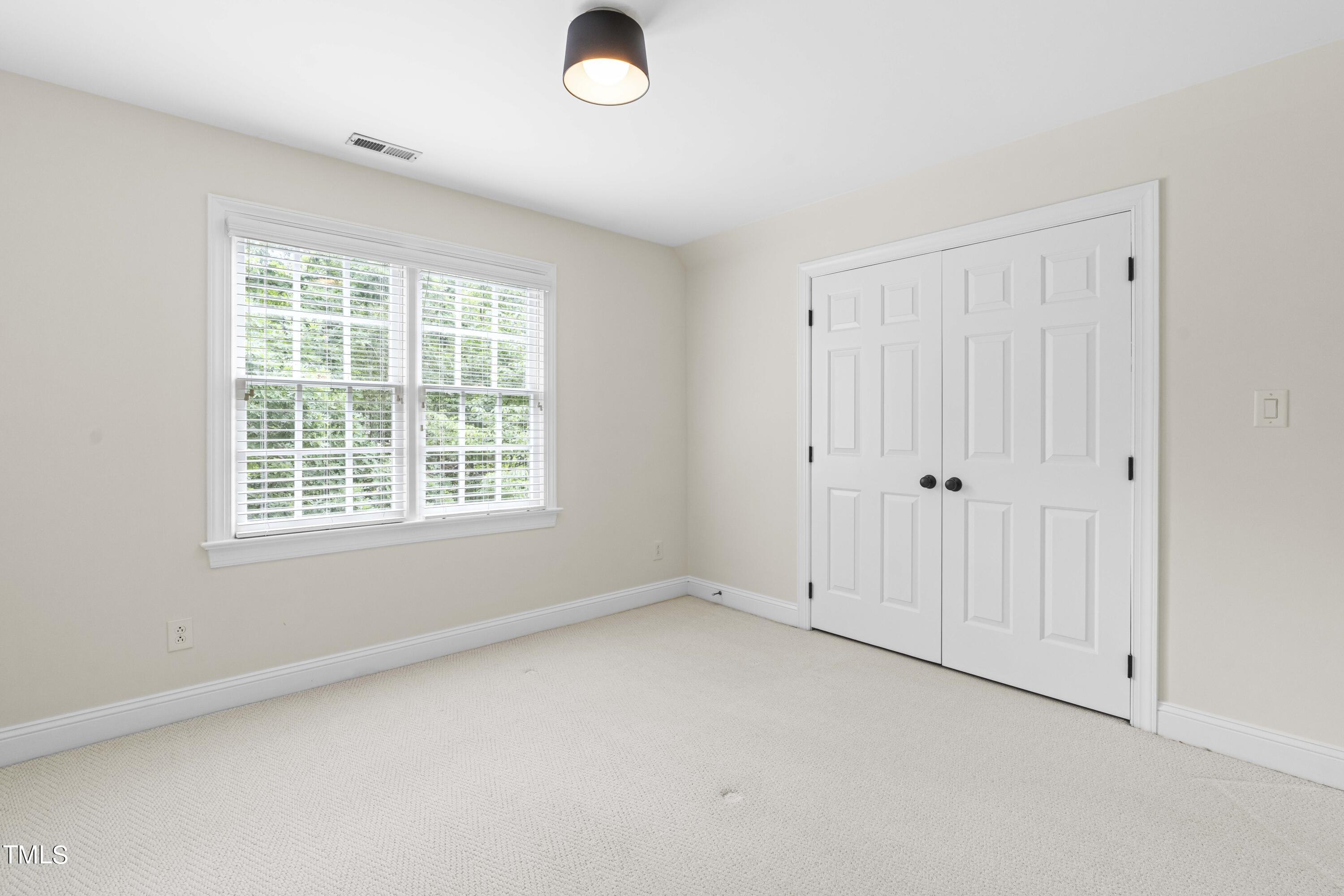 1556 Crenshaw Point Wake Forest, NC 27587 - Photo 33 of 46 an empty room with a empty space and windows