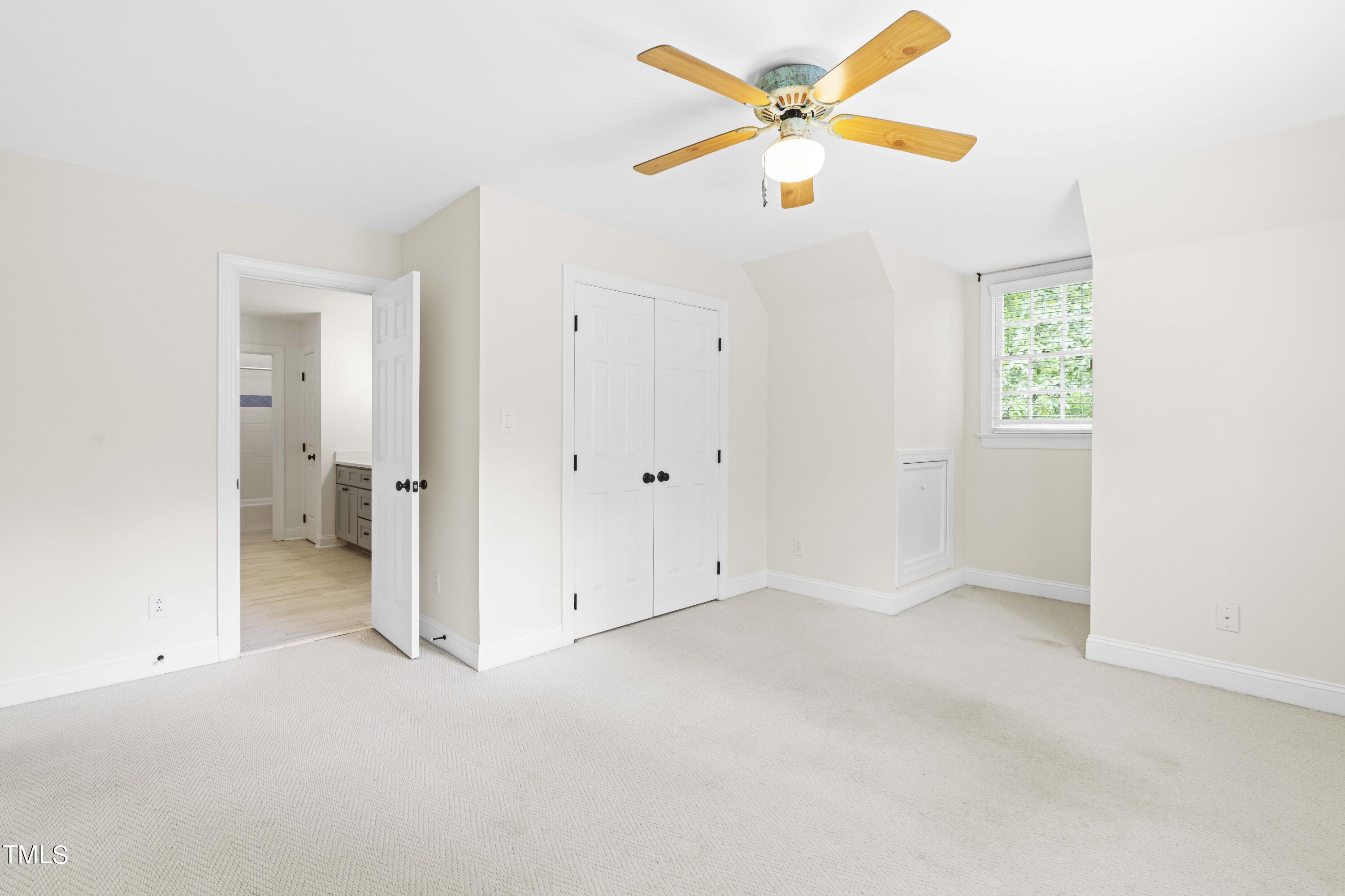 1556 Crenshaw Point Wake Forest, NC 27587 - Photo 35 of 46 an empty room with a window and a fan