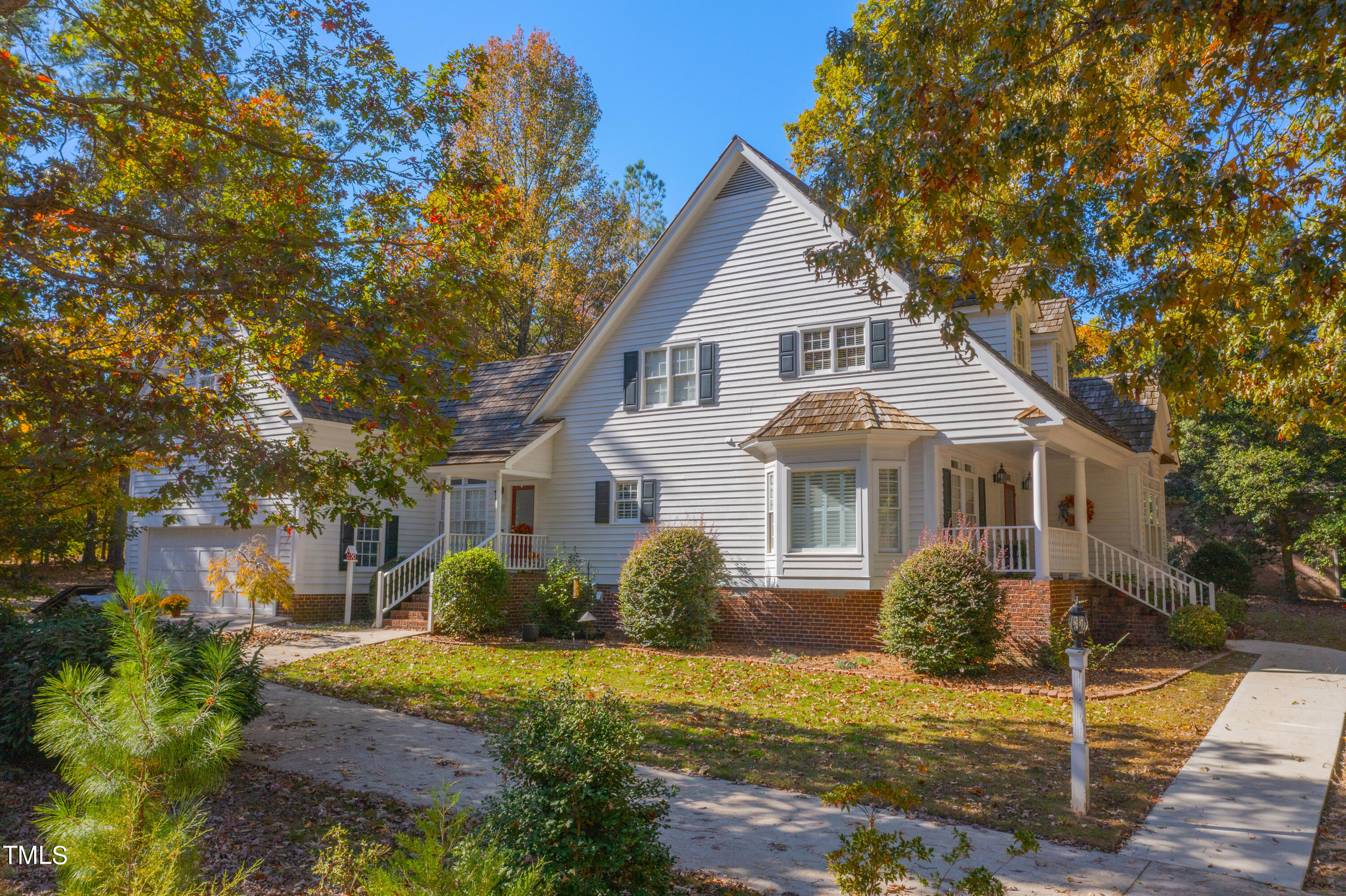 1556 Crenshaw Point Wake Forest, NC 27587 - Photo 41 of 46 a front view of a house with garden