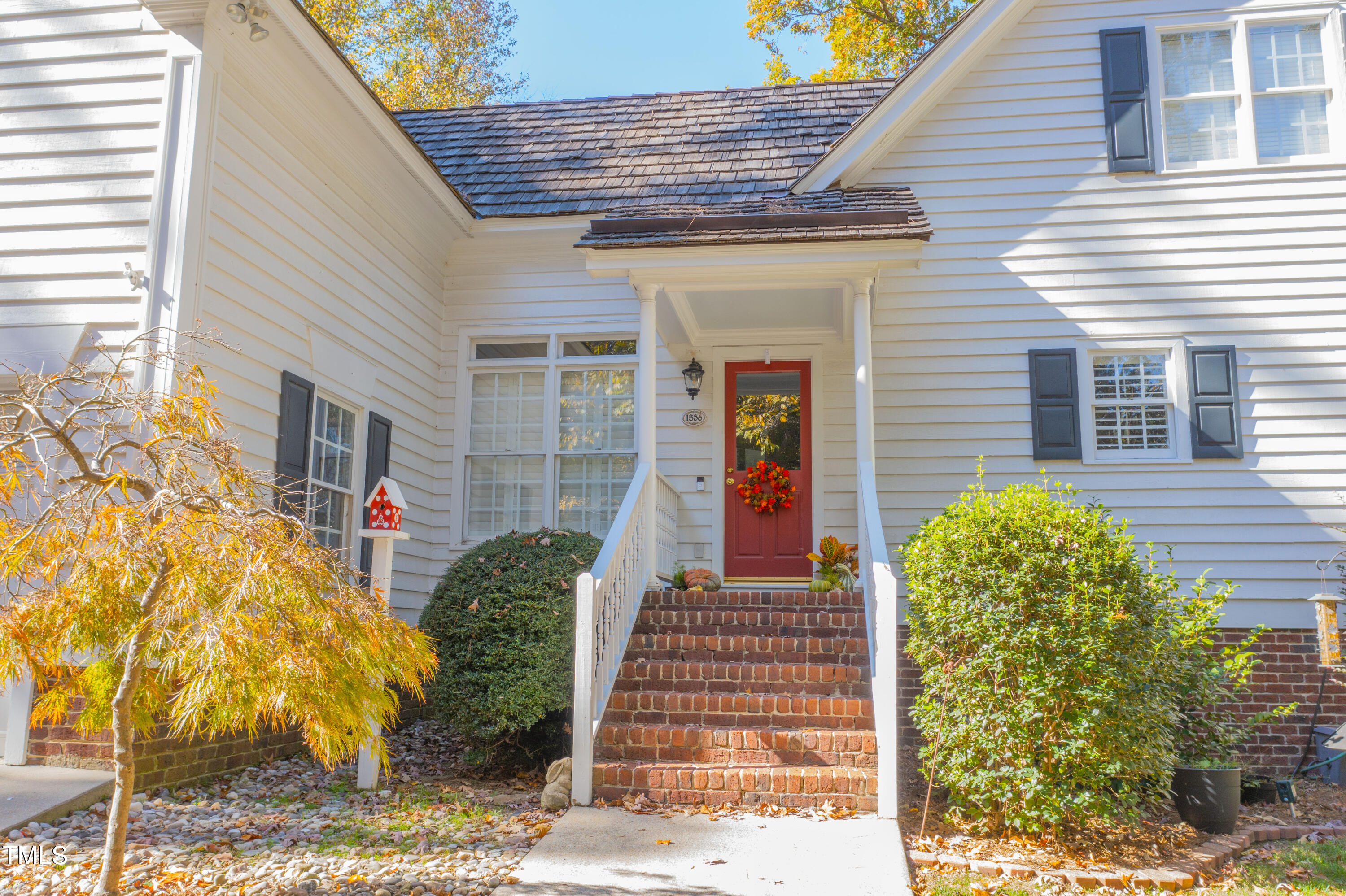 1556 Crenshaw Point Wake Forest, NC 27587 - Photo 42 of 46 a front view of a house with garden
