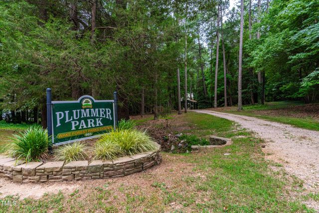a view of a chair and table in the garden