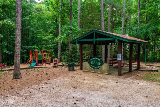 a view of a porch with furniture and floor to ceiling window