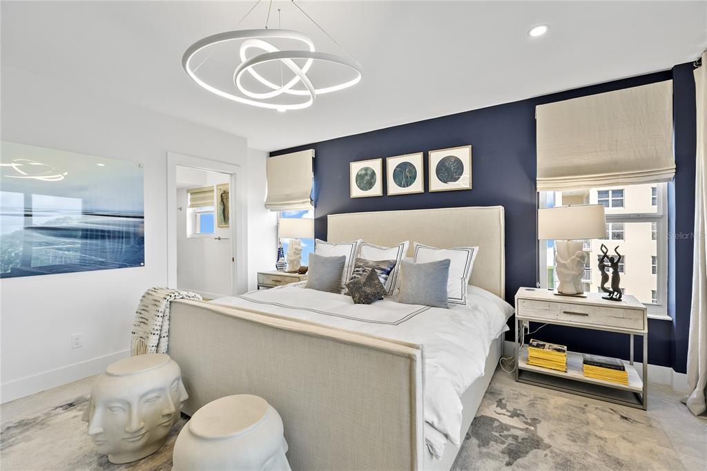 601 Longboat Club Road, Unit 404S Longboat Key, FL 34228 - Photo 17 of 28 a bedroom with a bed and wooden floor