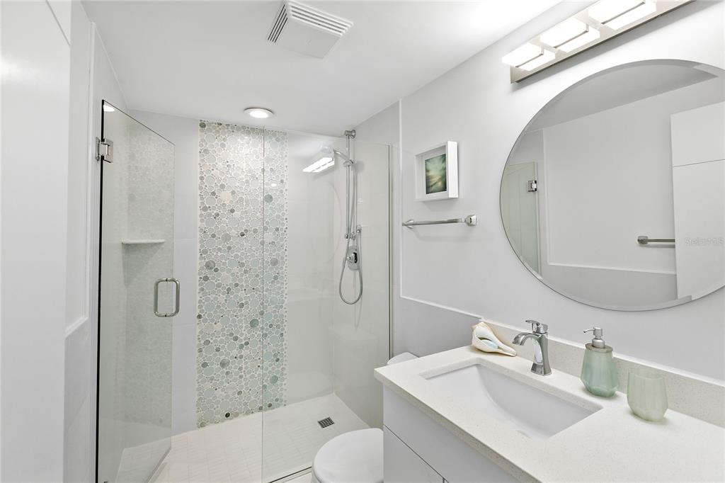 601 Longboat Club Road, Unit 404S Longboat Key, FL 34228 - Photo 23 of 28 a bathroom with a sink toilet and shower