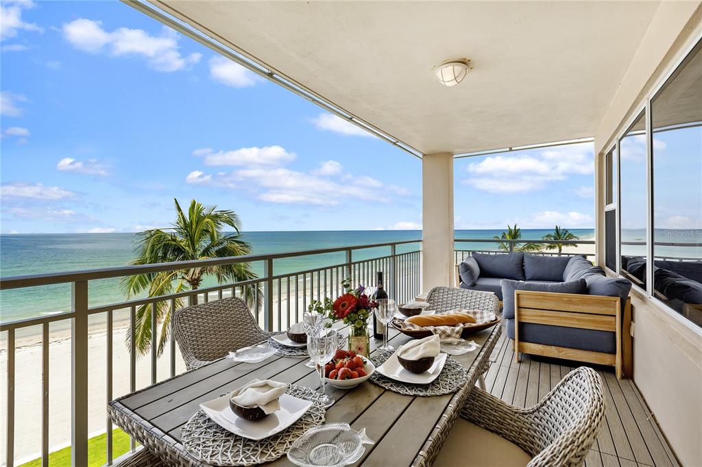 601 Longboat Club Road, Unit 404S Longboat Key, FL 34228 - Photo 24 of 28 a living room with furniture and a floor to ceiling window