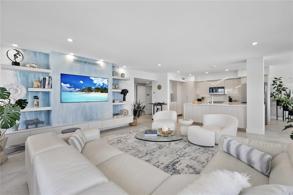 601 Longboat Club Road, Unit 404S Longboat Key, FL 34228 - Photo 4 of 28 a living room with furniture and a wooden floor