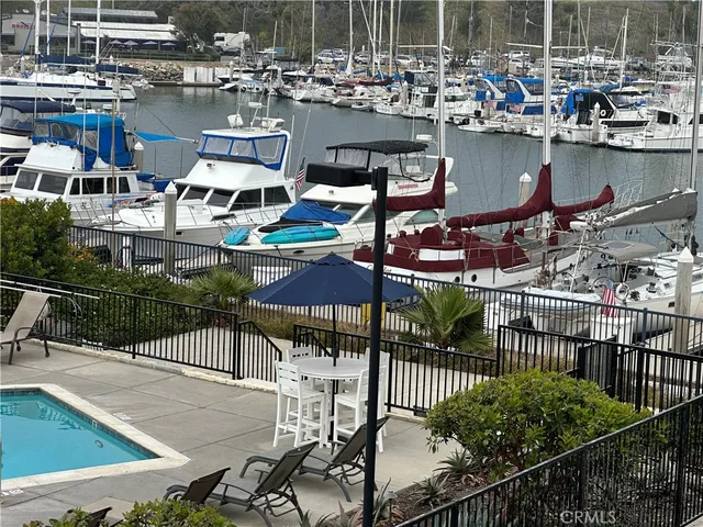 a view of a lake with outdoor seating