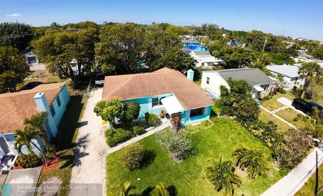 an aerial view of residential houses with outdoor space