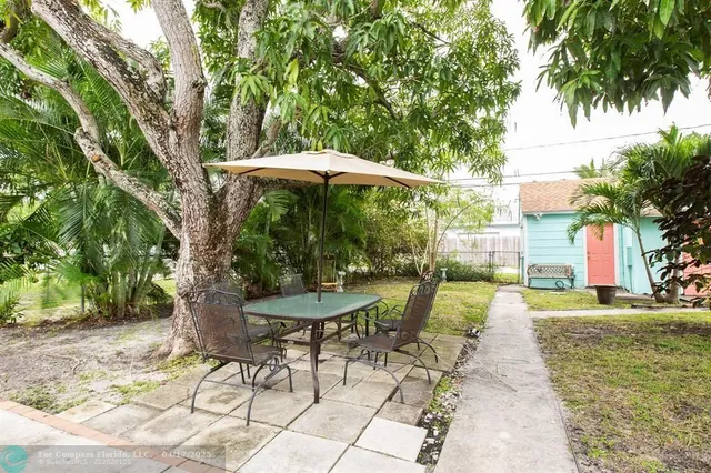 a view of a chair and table on the patio