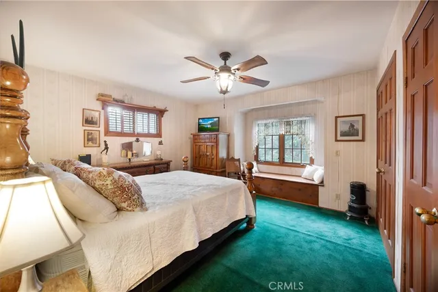 a bathroom with a toilet sink and shower