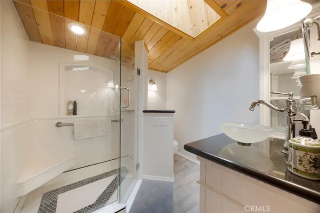 a bedroom with a bed and a dresser in it