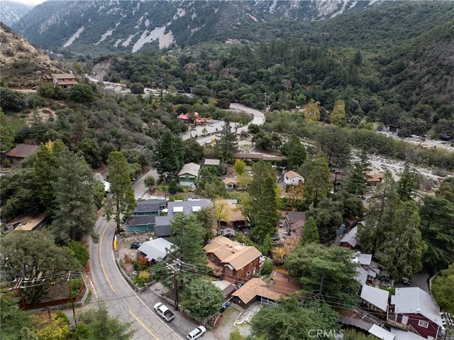 an aerial view of residential house with outdoor space and parking