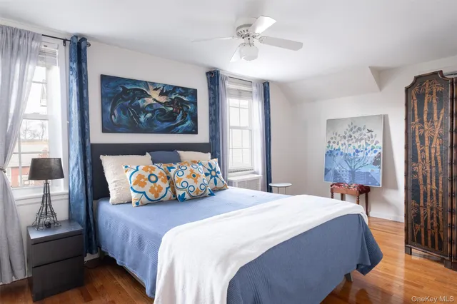 a bedroom with bed and window