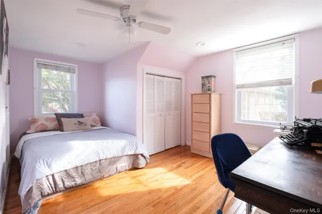 a bedroom with a bed and a dresser in it