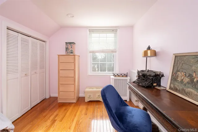 a bedroom with furniture and a window