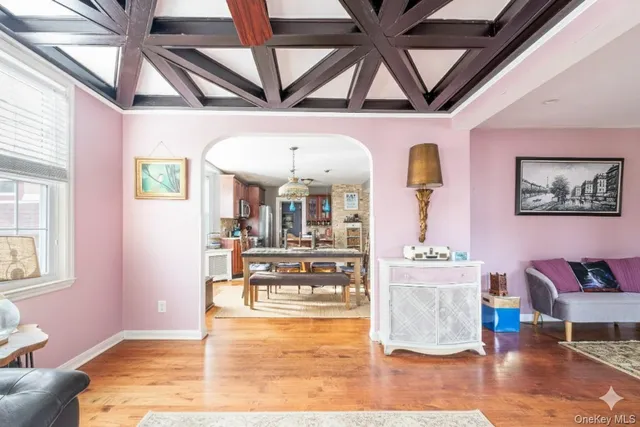 a living room with granite countertop furniture and a flat screen tv