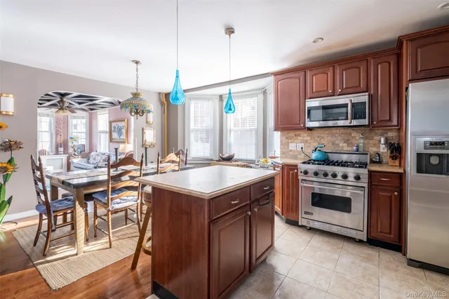 a kitchen with a stove sink and microwave