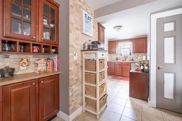 a kitchen with stainless steel appliances a stove and more cabinets