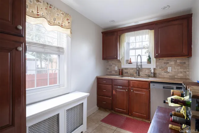 a kitchen with a window a sink and a counter top space