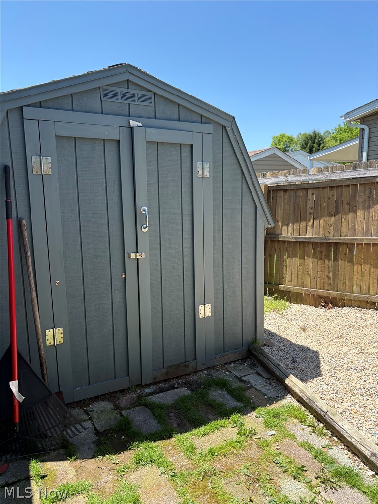 8701 Mayfield Road, Unit 148 Chesterland, OH 44026 - Photo 20 of 24 Freestanding storage shed featuring a gambrel roof and double entry doors