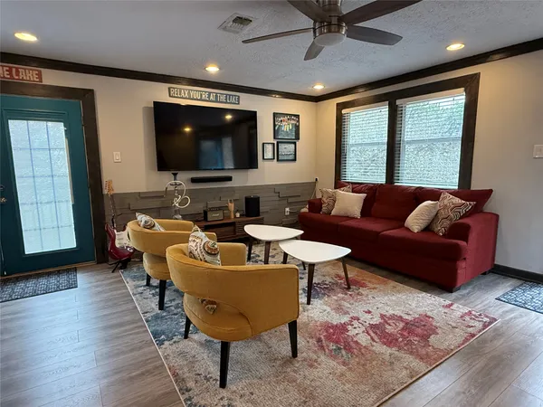 a living room with furniture and a flat screen tv
