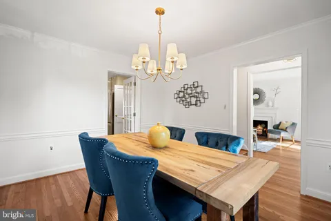 a kitchen with stainless steel appliances granite countertop a refrigerator sink and stove