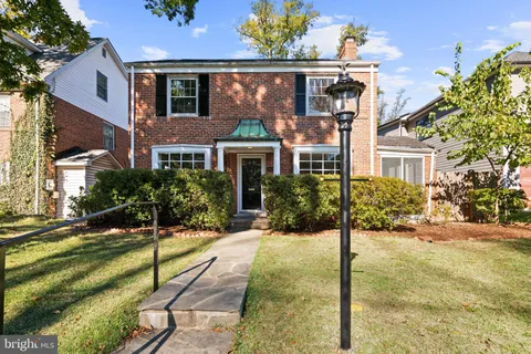 a view of a livingroom with wooden floor and fireplace