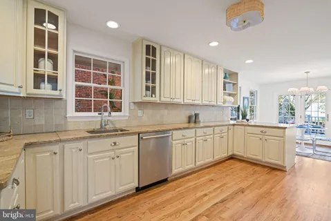 a bathroom with a sink a mirror and a shower