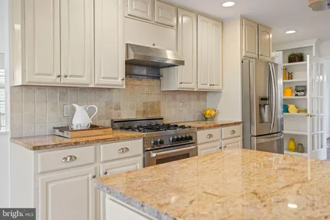 a view of balcony with wooden floor and outdoor seating