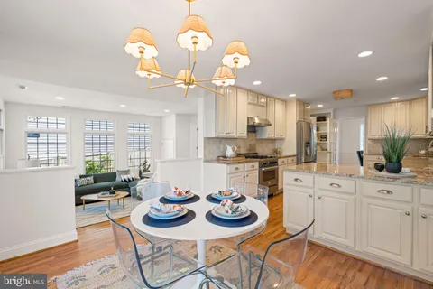 a spacious bedroom with a bed and a wooden floor