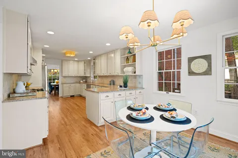 a bedroom with a bed flowerpot and window