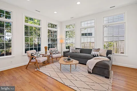 a bathroom with a granite countertop tub sink and mirror