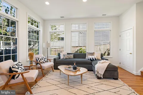 a bathroom with a bathtub a sink and a window