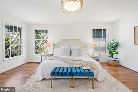 a view of a room with wooden floor and window