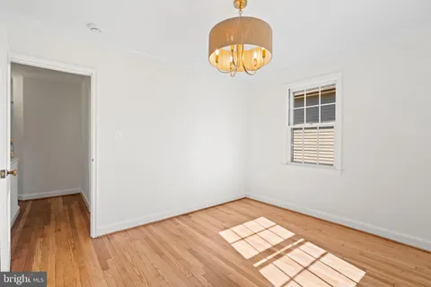 a sign that is sitting on a green field