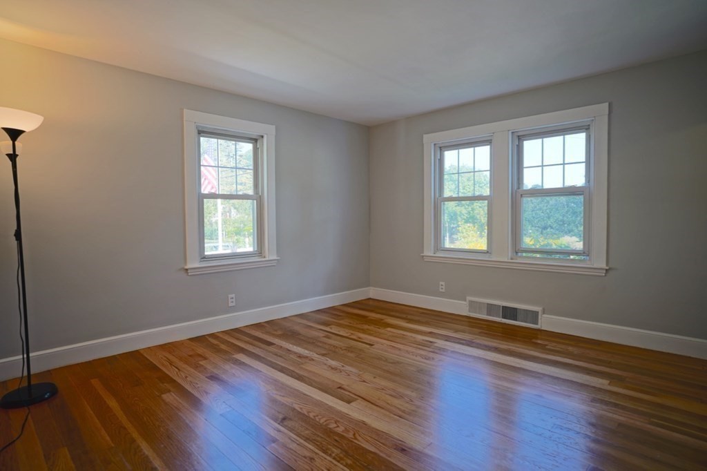 24 Peach Highlands Marblehead, MA 01945 - Photo 13 of 42 a view of an empty room with wooden floor and a window