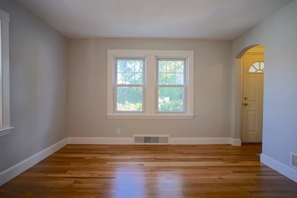 24 Peach Highlands Marblehead, MA 01945 - Photo 15 of 42 a view of empty room with wooden floor and window