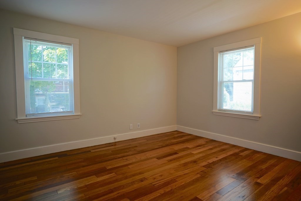 24 Peach Highlands Marblehead, MA 01945 - Photo 18 of 42 a view of a room with wooden floor and windows in it