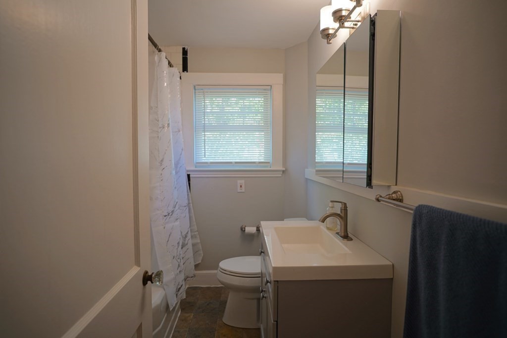24 Peach Highlands Marblehead, MA 01945 - Photo 21 of 42 a bathroom with a sink toilet and vanity