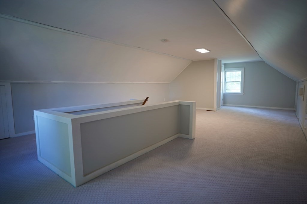 24 Peach Highlands Marblehead, MA 01945 - Photo 24 of 42 a view of an empty room with wooden floor and a window